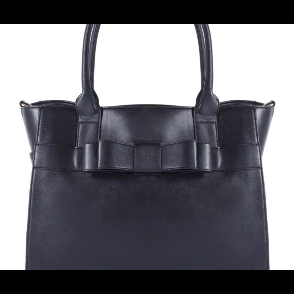 Stylish and subtle black tote for your fur baby!